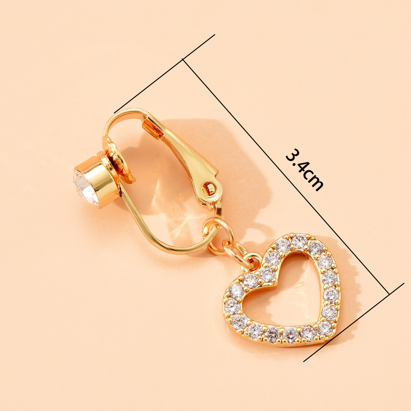 Non-piercing navel ring with a heart-shaped cubic zirconia