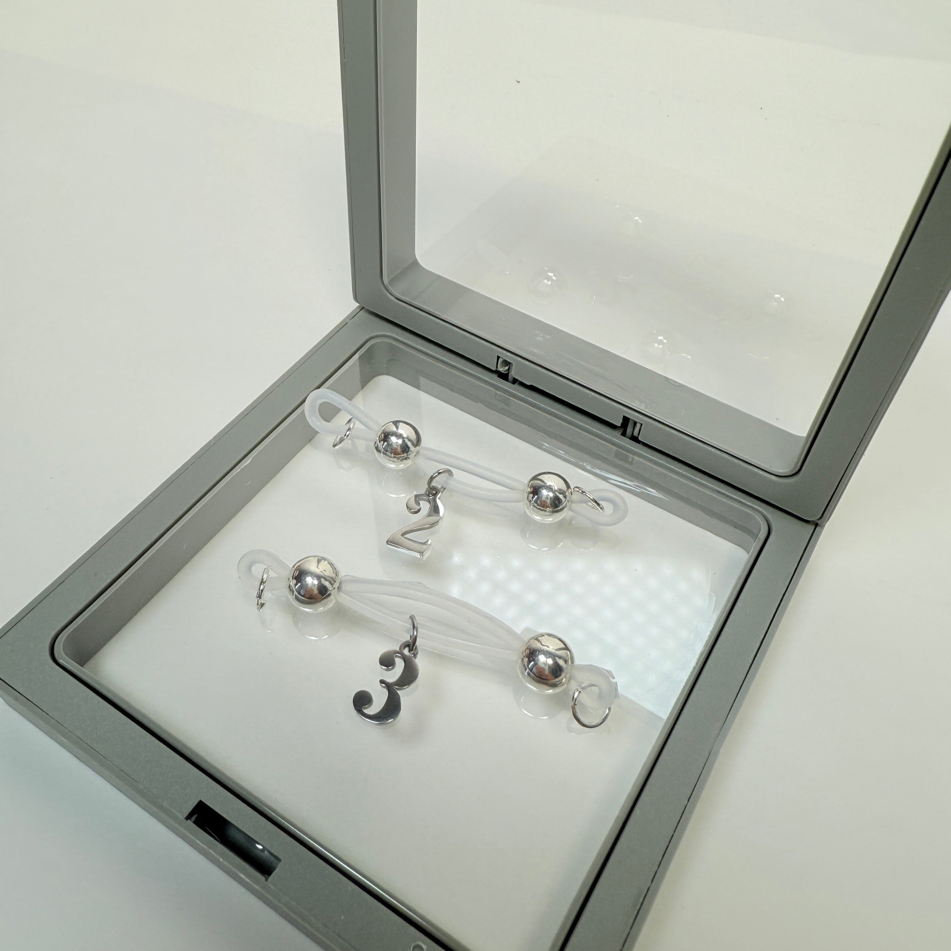 Adjustable nipple decoration - customizable with numbers 0-9