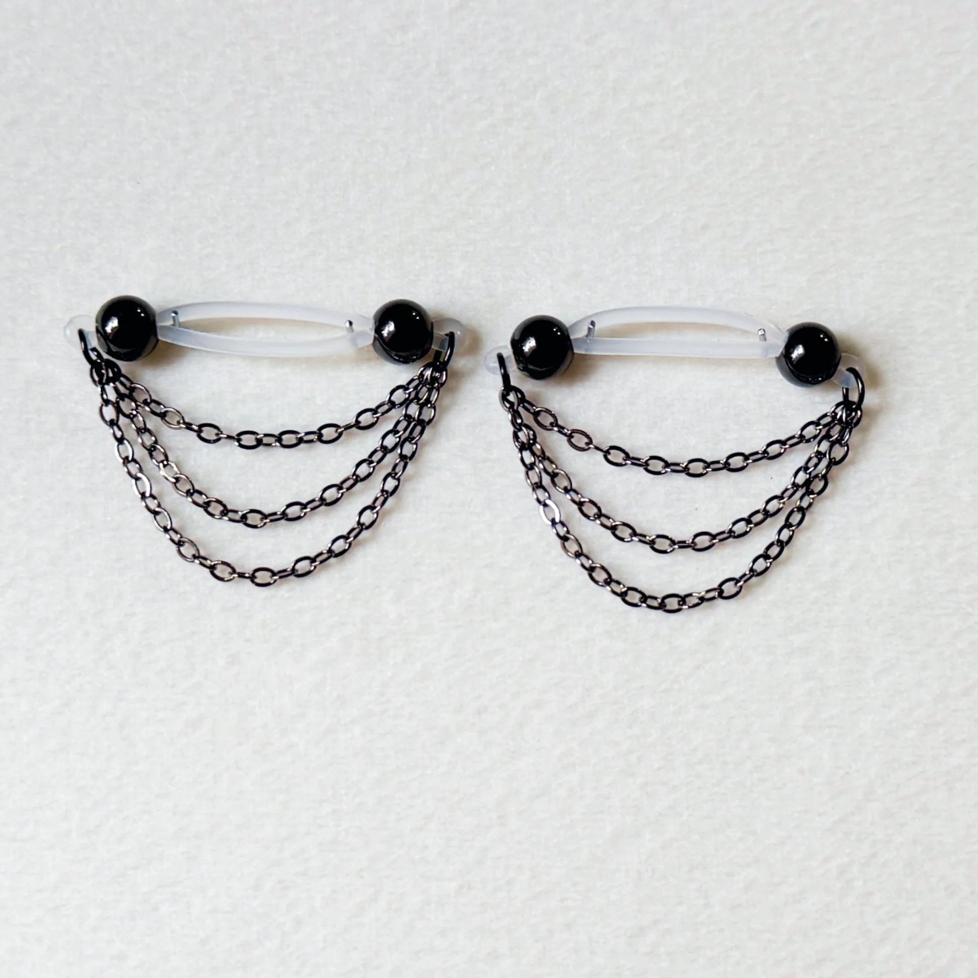Black barbell nipple ring - triple chain