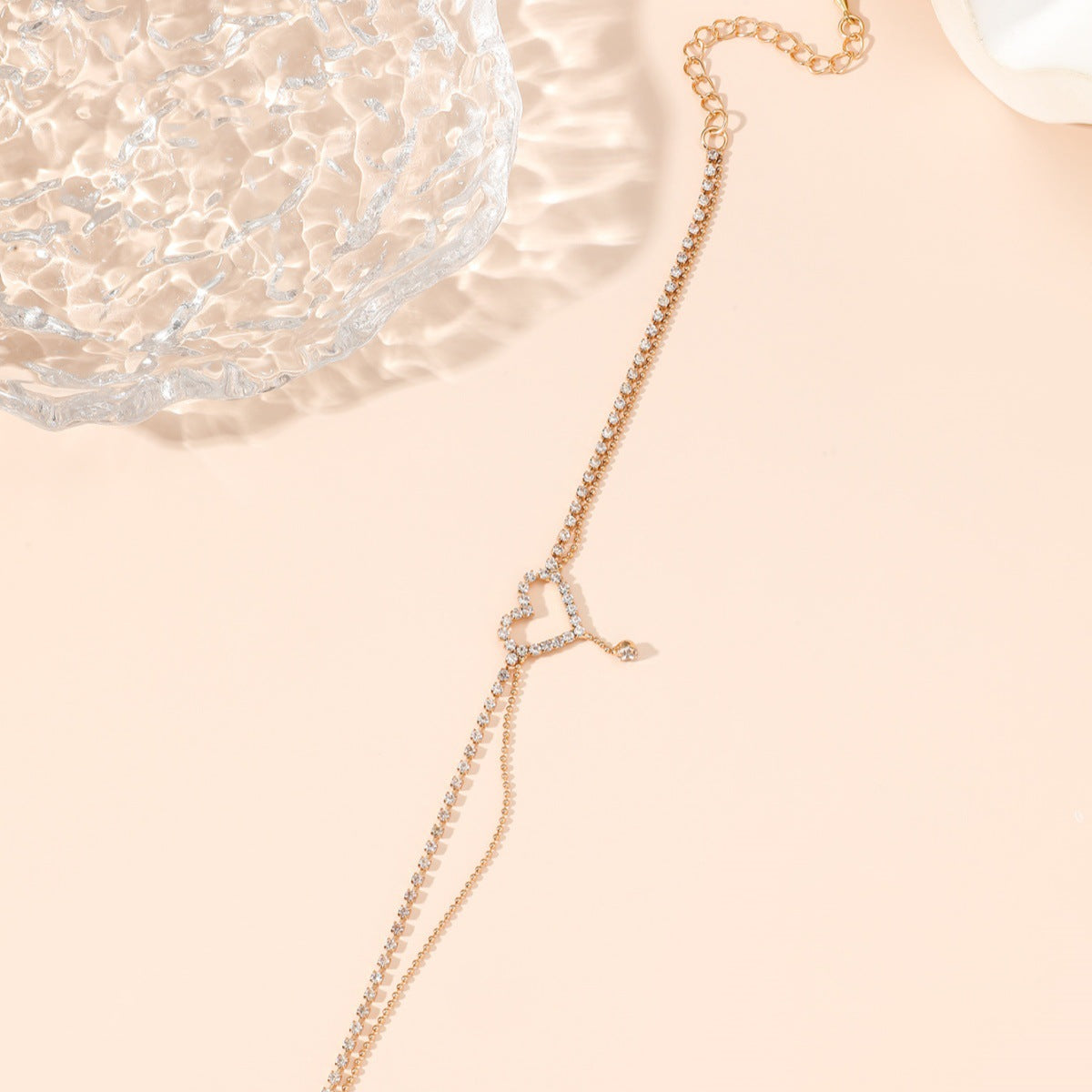 Diamond-encrusted heart-shaped anklet