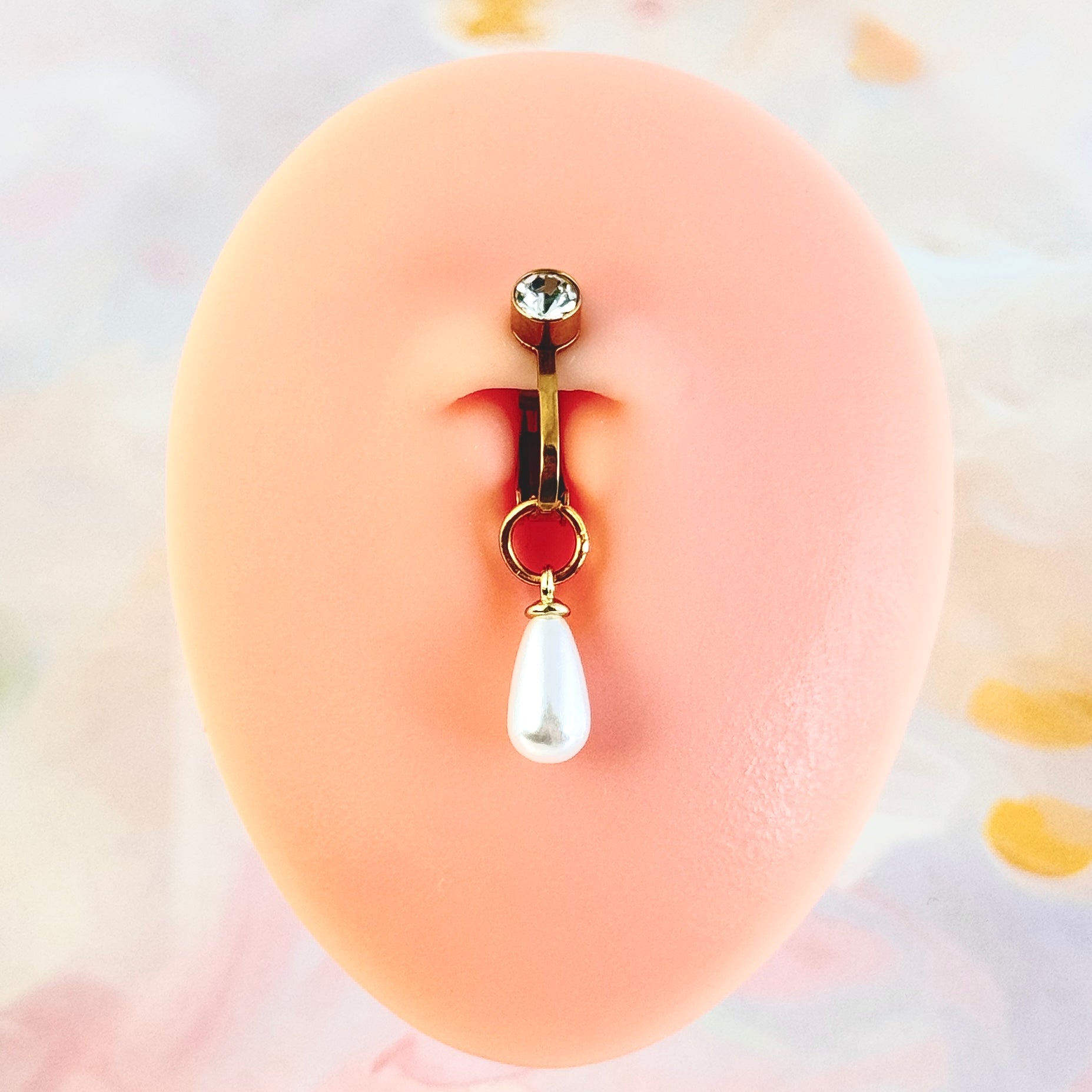 Adjustable pearl navel clip