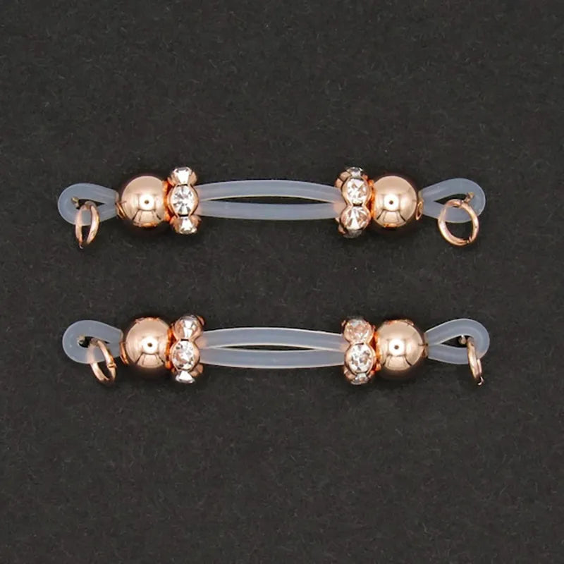Rose gold plated barbell style nipple ring with diamonds